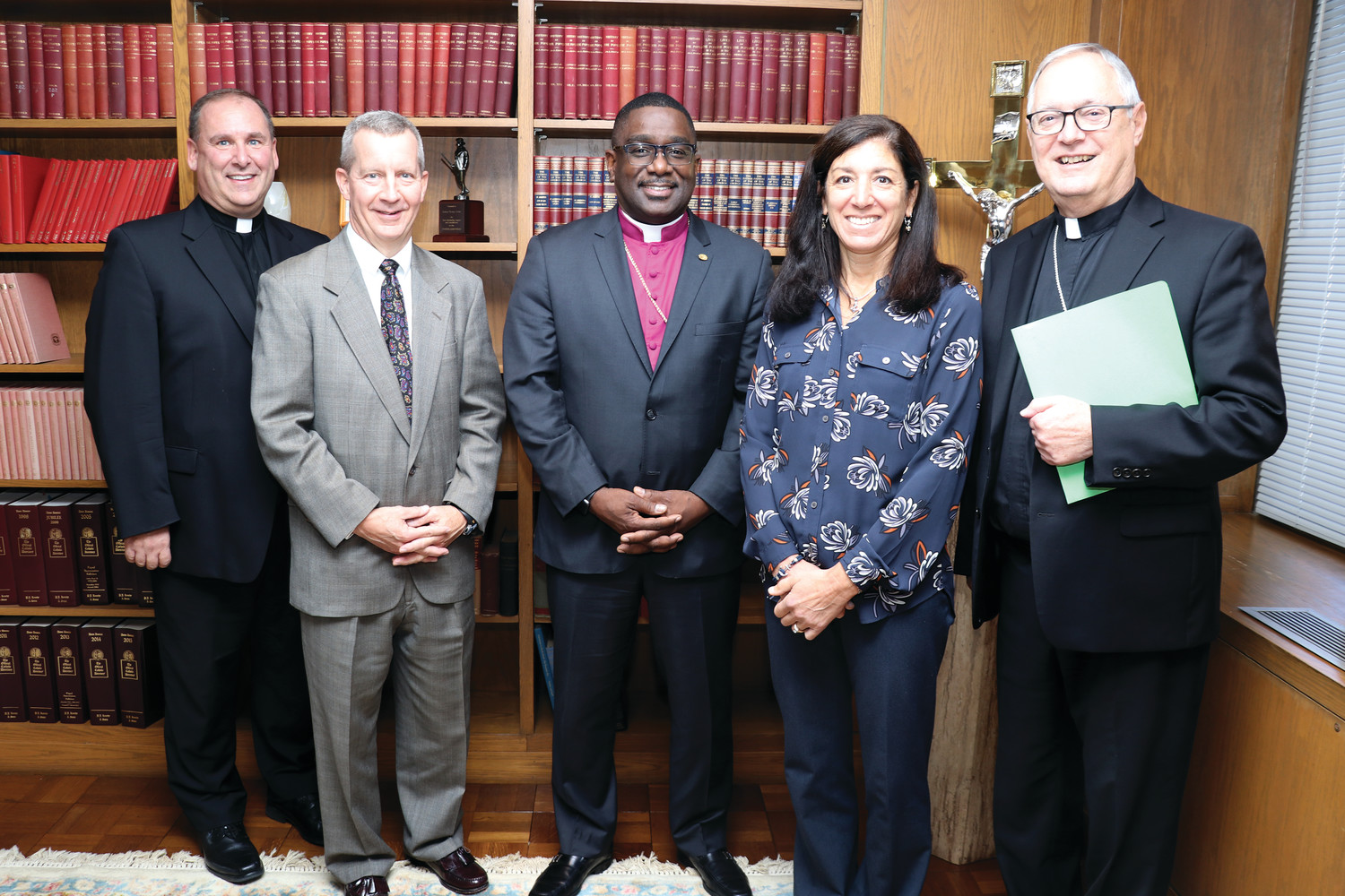 Bishop Thomas J. Tobin, right, and Msgr. Albert A. Kenney, vicar general and moderator of the curia, welcome Judge Stephen Isherwood, Bishop Jeffrey A. Williams and Karen Pinch to the Diocesan Advisory Board for the Protection of Children and Young People.
